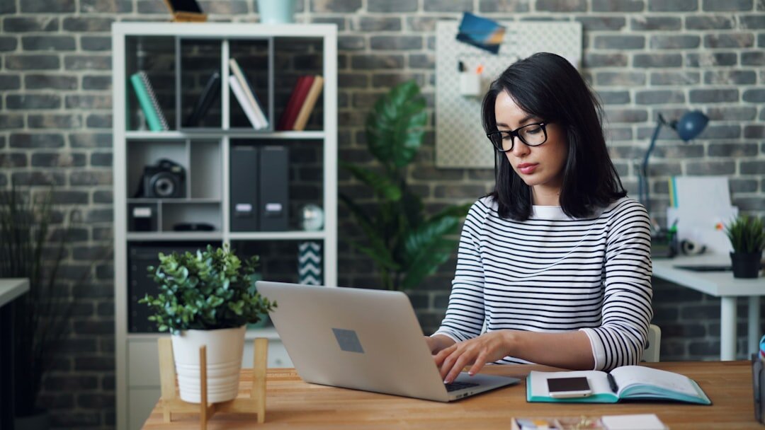 journalist at desk with laptop