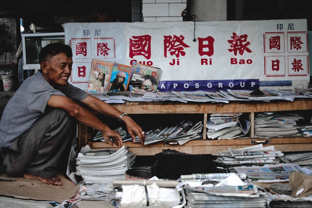 person reading newspaper