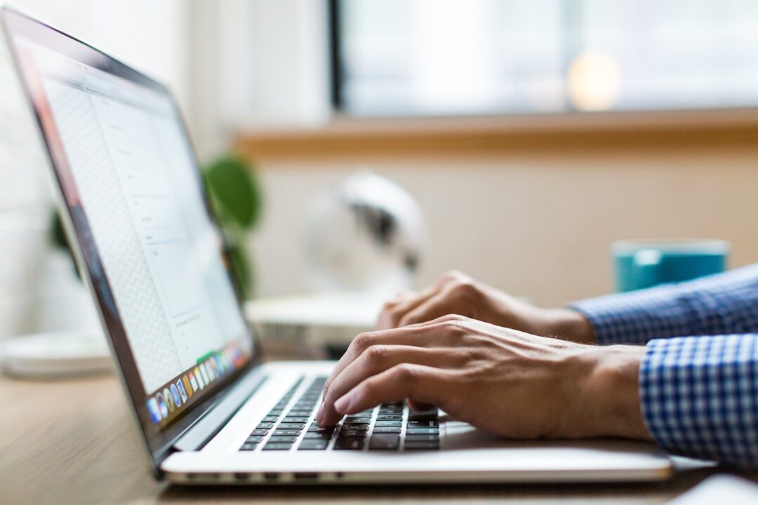 person using laptop for news research