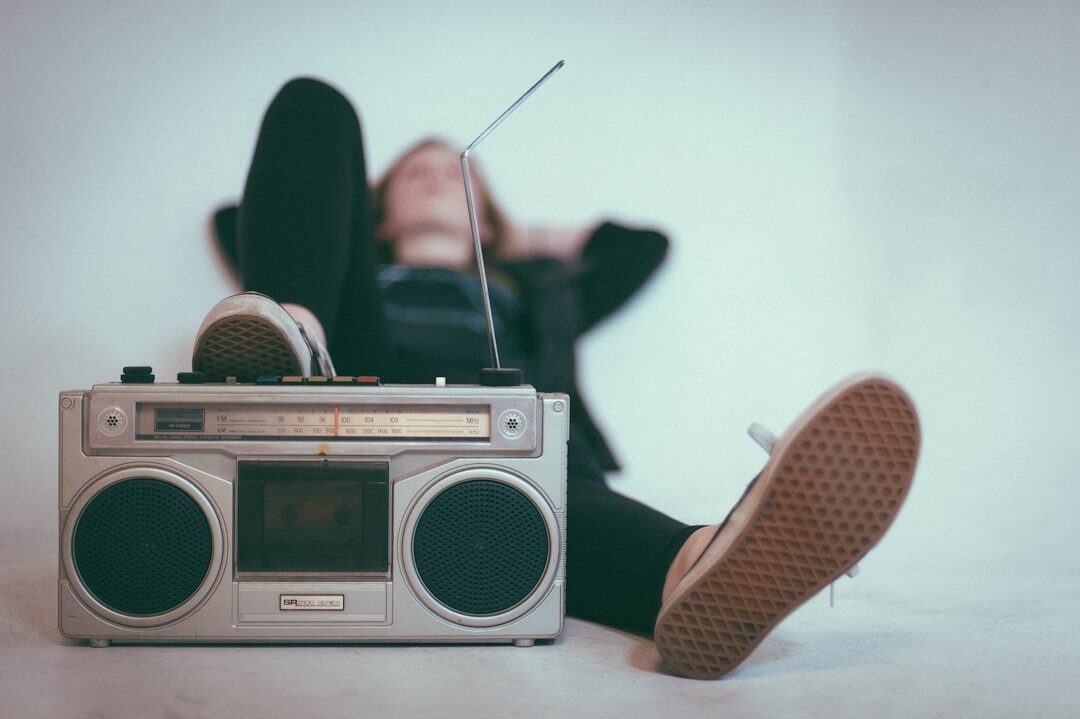person tuning radio dial